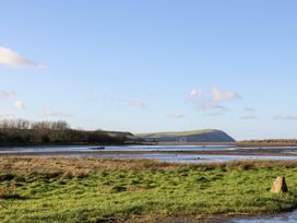A landscape with water and hills at Bryncyn in Newport, Pembrokeshire