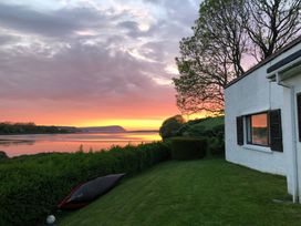 A house with a kayak by the river at Bryncyn in Newport, Pembrokeshire