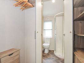 A bathroom with a shower and toilet at 2 Summerleaze in Bude
