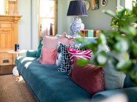 A living room with a sofa and cushions at The Country House Cumbria Castle Carrock