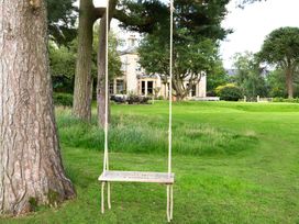 A swing in a garden at The Country House Cumbria Castle Carrock