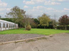 An outdoor area with a tent and trees at Pompian Lodge Leyland