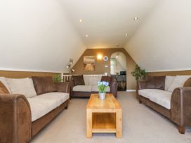 A living room with sofas and a coffee table at Valley Lodge 61 in Callington