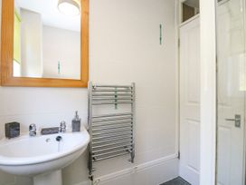 A bathroom with a sink and mirror at Valley Lodge 61 Callington