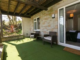 An outdoor area with seating and plants at Valley Lodge 61 Callington