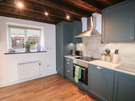A kitchen with cabinets and appliances at The Loft in Glenmore, County Kilkenny