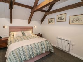 A bedroom with a bed and wall art at The Loft in Glenmore, County Kilkenny