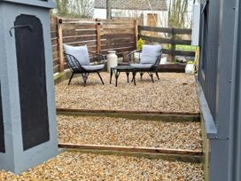 An outdoor seating area with chairs and a table at The Loft in Glenmore, County Kilkenny