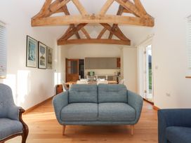 A living room with a sofa and armchair at Hilldown Cott near Bow