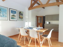 A dining room with a table and chairs at Hilldown Cott near Bow