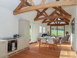 A dining room with a table and chairs at Hilldown Cott near Bow