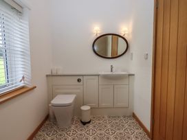 A bathroom with a sink and toilet at Hilldown Cott near Bow