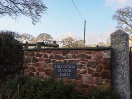 A farm entrance sign at Hilldown Manor Farm near Bow