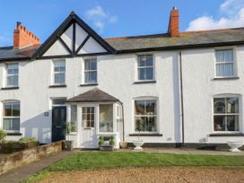 A house with windows and a door at The Hideaway in Penrhyn Bay