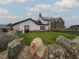 A house with solar panels and a garden at Hen Penmynydd in Llanfwrog near Llanfachraeth