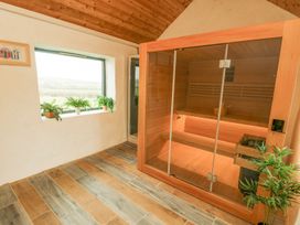 A sauna with a window and plants at Hen Penmynydd in Llanfwrog near Llanfachraeth