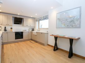 A kitchen with cabinets and a sink at Hen Penmynydd Llanfwrog near Llanfachraeth