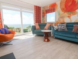 A living room with sofas and a coffee table at Shearwater in Praa Sands