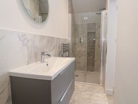 A bathroom with sink and shower at Shearwater in Praa Sands