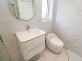 A bathroom with a sink and toilet at Shearwater in Praa Sands