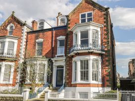 A building with multiple windows and a balcony at Esplanade Gardens, Apartment 1 Scarborough