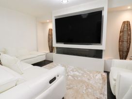 A living room with a sofa and television at 49 Mellings Place