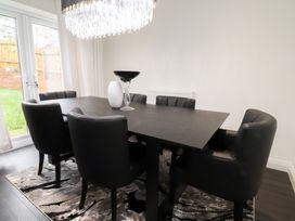 A dining room with a table and chairs at 49 Mellings Place