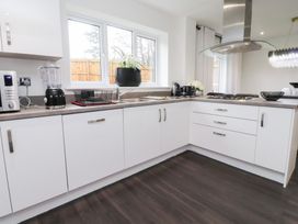 A kitchen with appliances and sink at 49 Mellings Place
