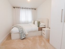 A bedroom with a bed and nightstand at 49 Mellings Place