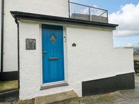An entrance door with a blue color at 4 Brynteg Terrace in Menai Bridge