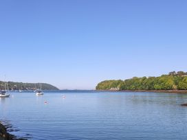 A view of boats on water with trees in the background at 4 Brynteg Terrace Menai Bridge