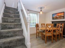 A dining room with a table and chairs at 4 Brynteg Terrace in Menai Bridge