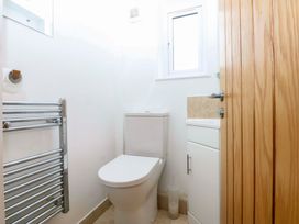 A bathroom with a toilet and sink at 4 Brynteg Terrace in Menai Bridge