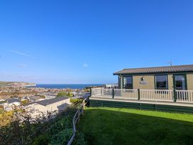 A view of the sea and surroundings from a mobile home at 91 Swanage Coastal Park in Swanage