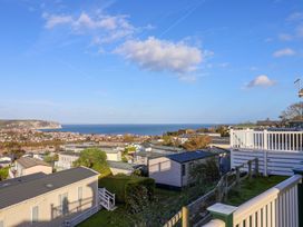 A view of the sea and houses at 91 Swanage Coastal Park in Swanage