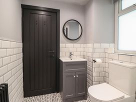 A bathroom with a sink and toilet at Green Bank in Betws-Y-Coed