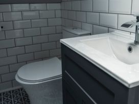 A bathroom with a sink and toilet at Green Bank in Betws-Y-Coed