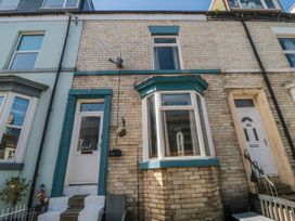 A house front with windows and a door at Captain Jacks in Whitby