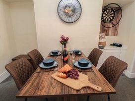 A dining room with a table set for dinner at Captain Jacks in Whitby