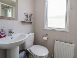 A bathroom with a sink and toilet at MC15 in Rhyl
