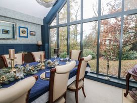A dining room with a table set for dinner at Chapel Hill, Catlowdy