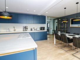 A kitchen with a dining area and appliances at Chapel Hill in Catlowdy