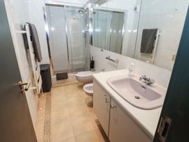 A bathroom with a shower and sink at Chapel Hill in Catlowdy
