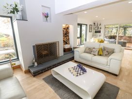 A living room with a sofa and chess set at Chapel Hill in Catlowdy