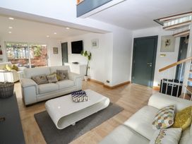 A living room with a sofa and coffee table at Chapel Hill in Catlowdy