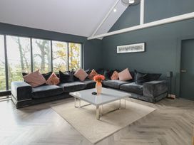 A living room with a sofa and table at Chapel Hill in Catlowdy