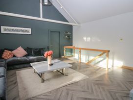 A living room with a sofa and coffee table at Chapel Hill in Catlowdy