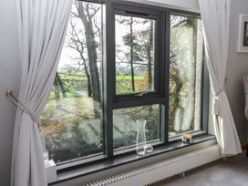 A window with a view and a radiator in the living room at Chapel Hill in Catlowdy