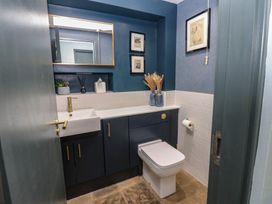 A bathroom with a sink and toilet at Chapel Hill in Catlowdy