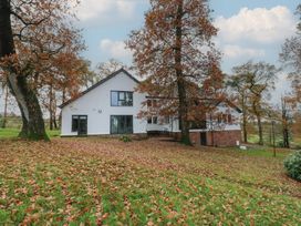 A house surrounded by trees and leaves at Chapel Hill in Catlowdy